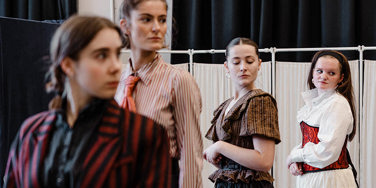 Four female actors stood in a line in Jekyll and Hyde rehearsals, in costume