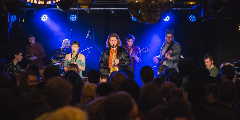 Jazz band playing in crowded venue