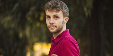 Toby Cook holding a violin